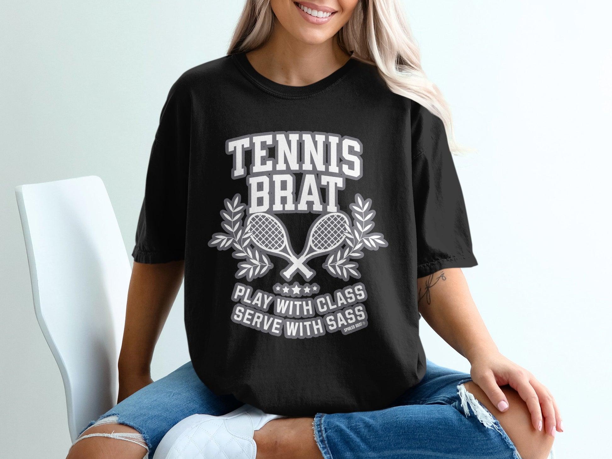 Black t-shirt with "Tennis Brat" and crossed racquets graphic.