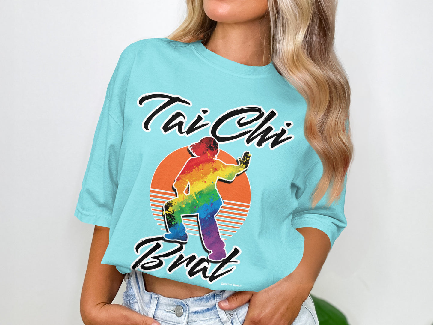 Aqua t-shirt with rainbow Tai Chi figure and "Tai Chi Brat" text.