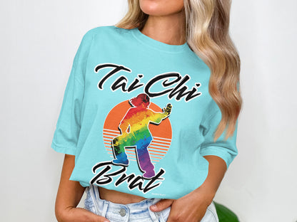 Aqua t-shirt with rainbow Tai Chi figure and "Tai Chi Brat" text.