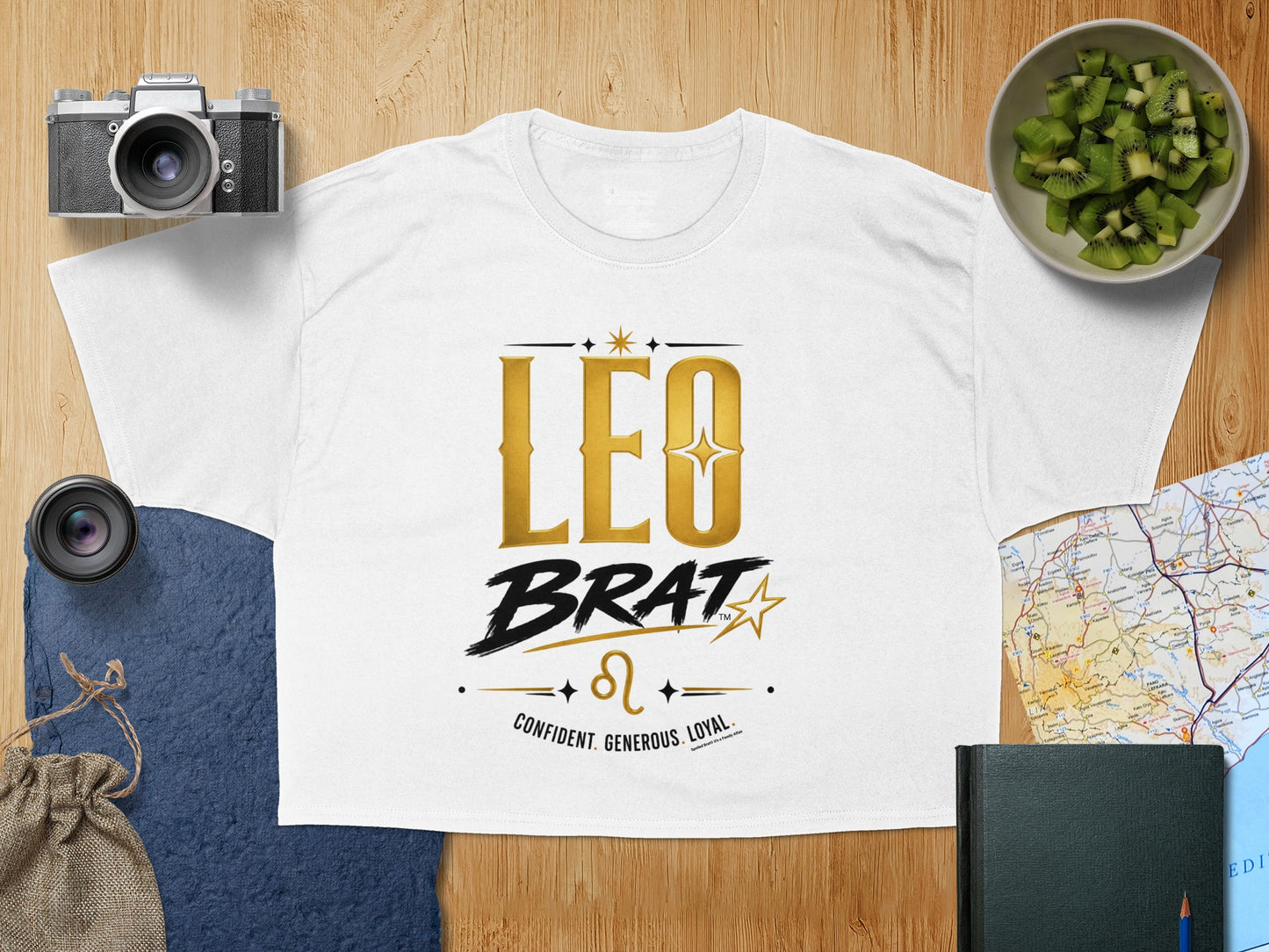 White t-shirt with "LEO BRAT" and Leo symbol, text reads: CONFIDENT. GENEROUS. LOYAL.