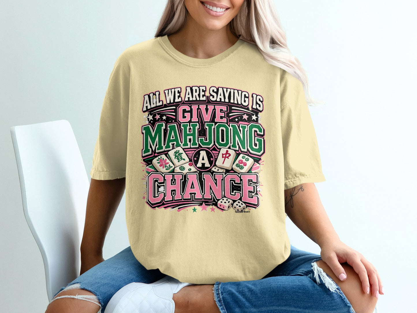 Light yellow t-shirt with "Give Mahjong a Chance" text and dice graphics.