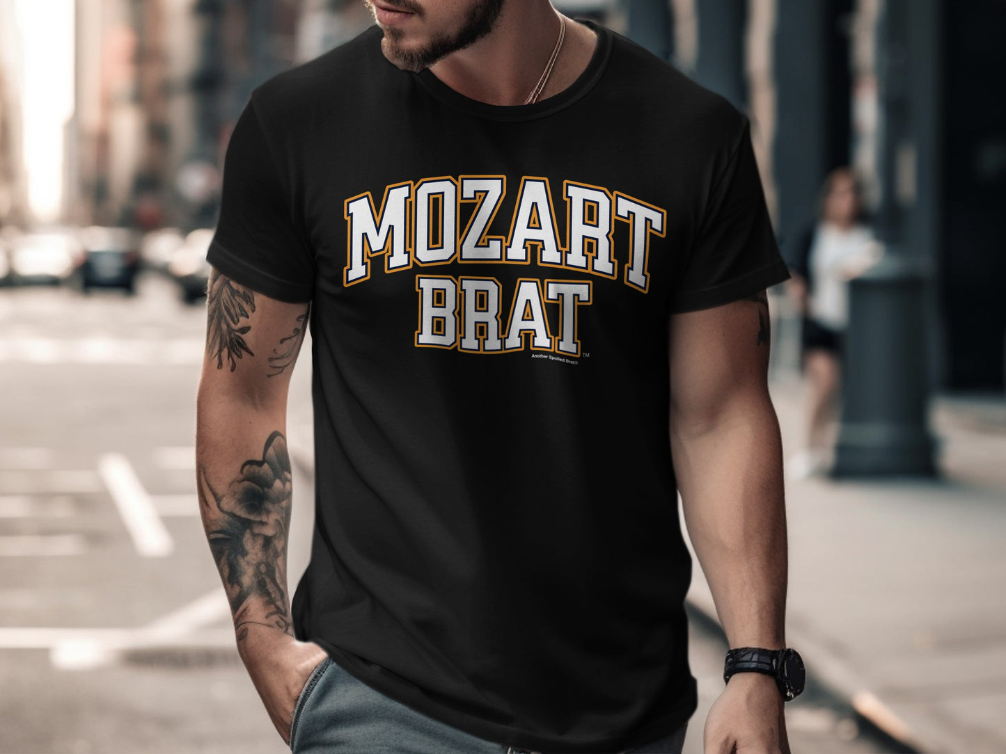 Black t-shirt with "MOZART BRAT" text in collegiate style font.