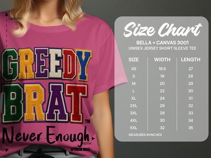 Pink t-shirt with "GREEDY BRAT" and "Never Enough" text, with a size chart.