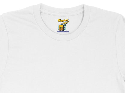 White t-shirt with "Travel Brat" logo featuring suitcase and palm trees.
