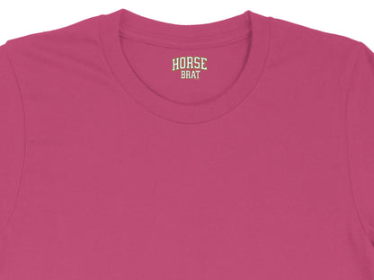 Pink t-shirt with "HORSE BRAT" text logo on the neck label.