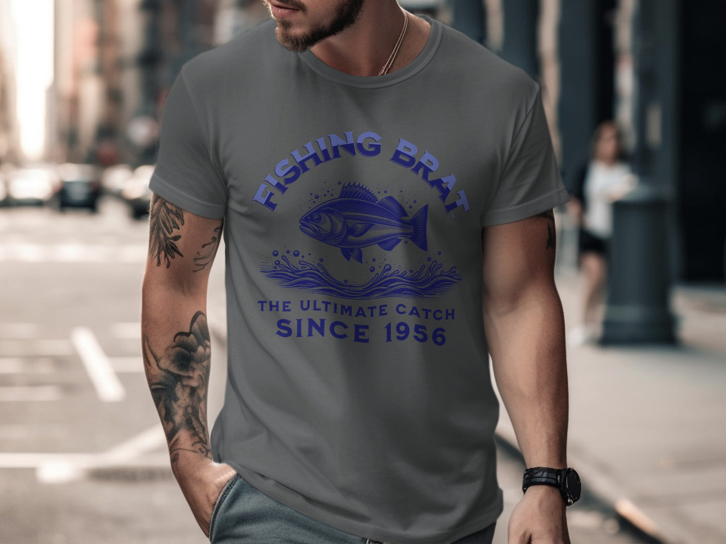 Gray t-shirt with "FISHING BRAT THE ULTIMATE CATCH SINCE 1956" and fish graphic.