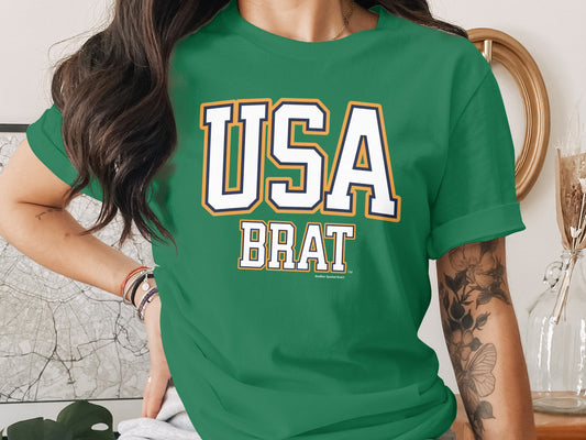 Green t-shirt with "USA BRAT" text and "Another Spoiled Brat" subtitle.