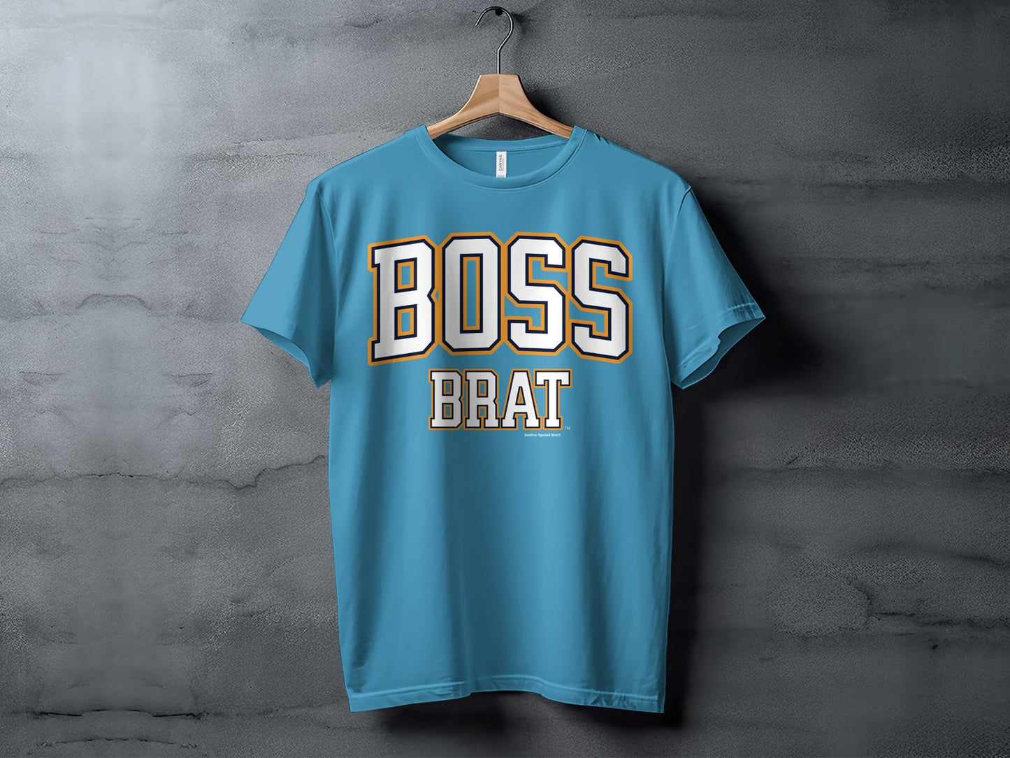 Light blue t-shirt with "BOSS BRAT" text in white and orange letters.