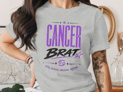 Grey t-shirt with "CANCER BRAT" and astrological symbols.