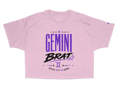 Pink crop top with "GEMINI BRAT" and astrological symbols.
