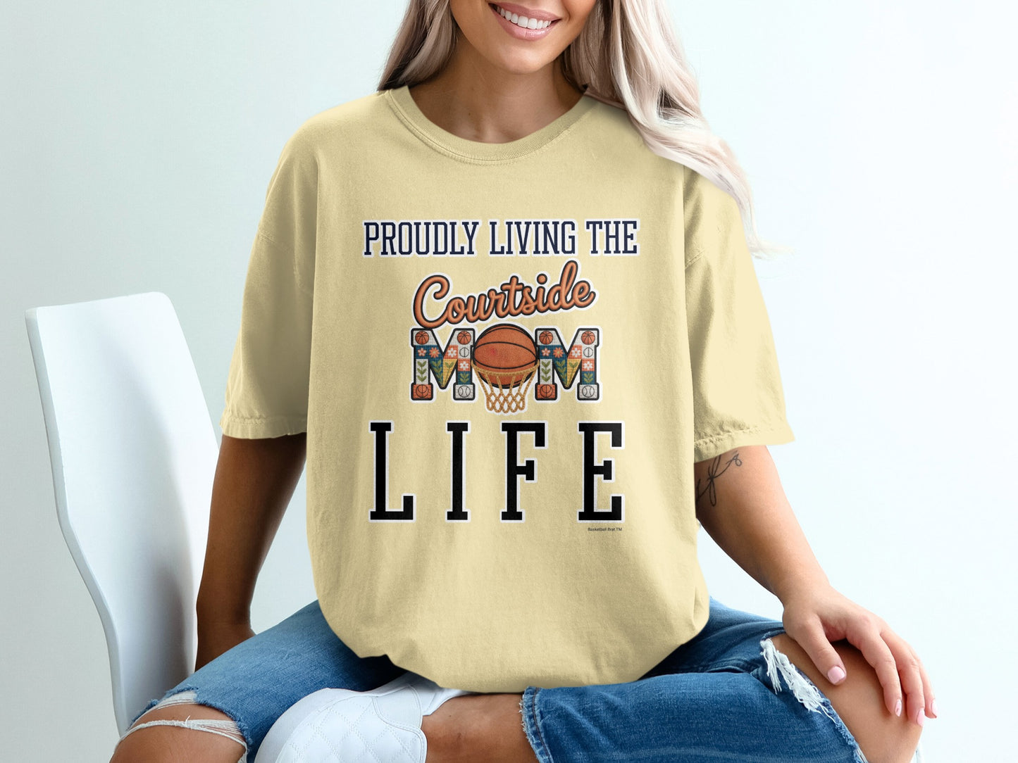 Pale yellow t-shirt with "Proudly Living the Courtside Mom Life" graphic.