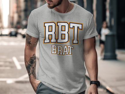 Grey t-shirt with "RBT BRAT" text in white with navy and gold outline.